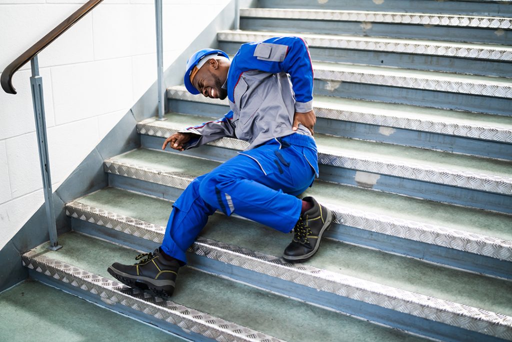 Worker Man Lying On Staircase